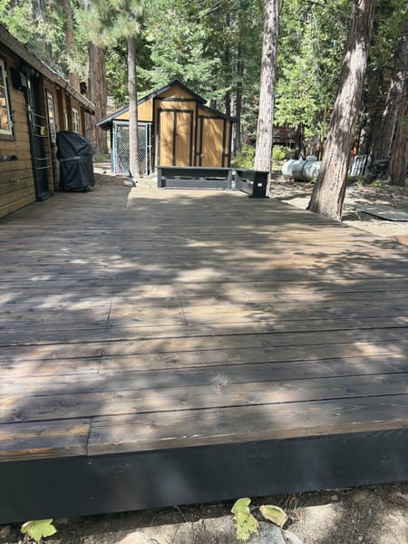 Long restained deck along a cabin