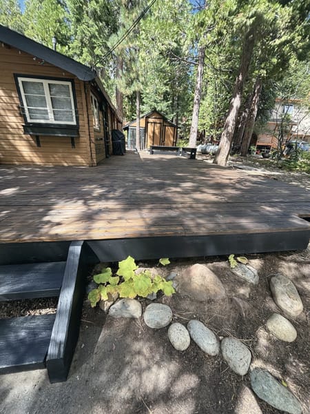 Edge of a new deck with plants below